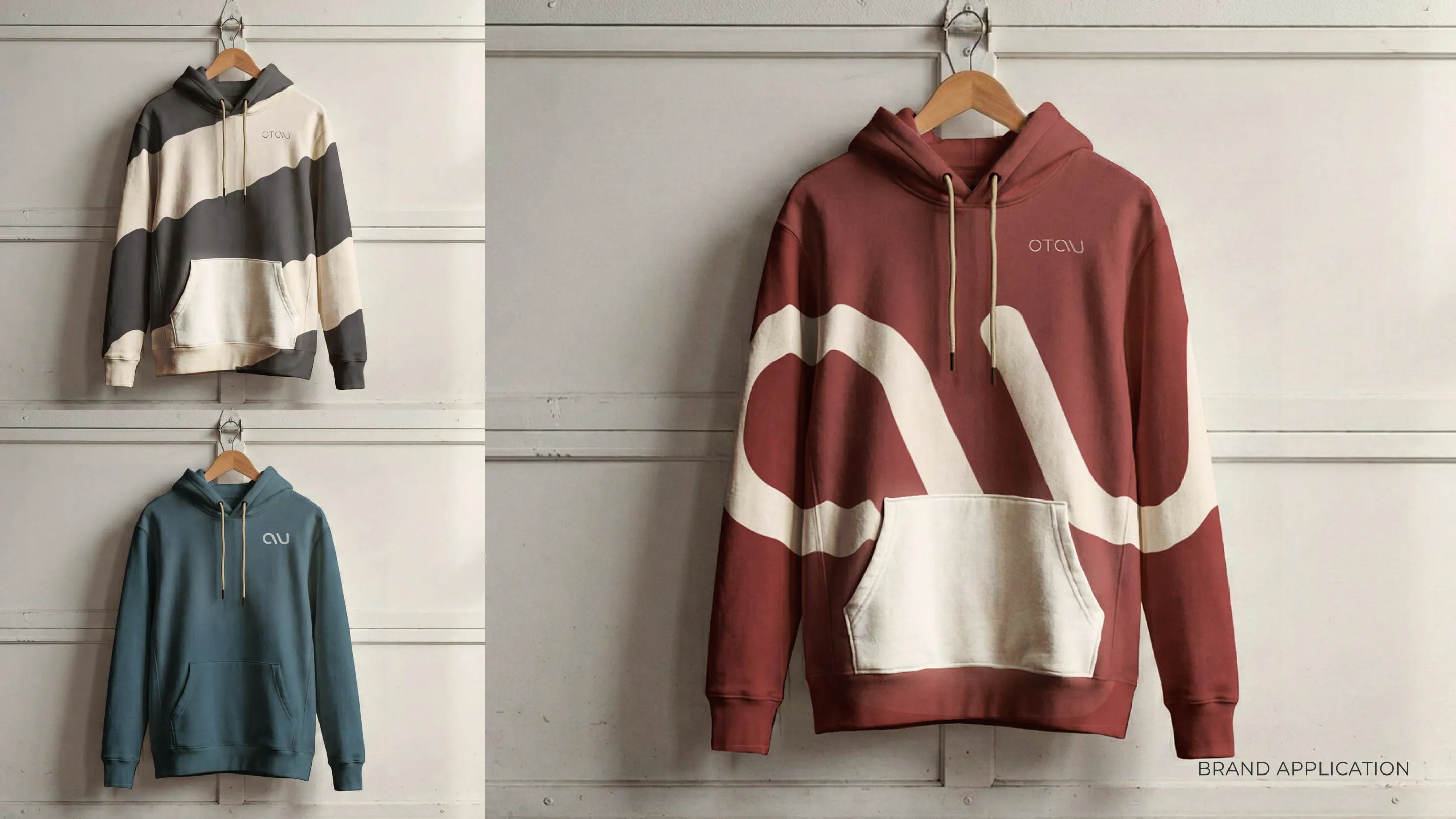 Hoodies in cream, teal and garnet with the OTAU logotype and a large cropped isotype